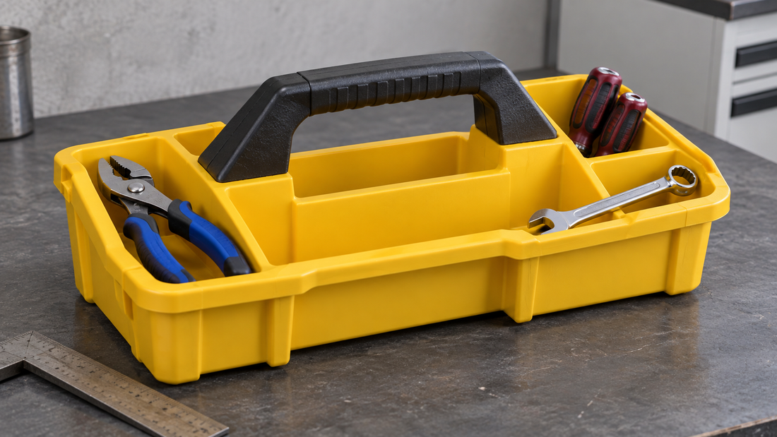 Tools sit in a yellow tote’s outer compartments, leaving the carrying handle and finger space unobstructed.