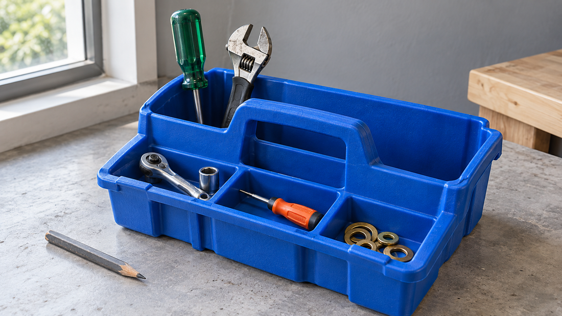 Tall tools sit in a blue tote’s deep section while smaller front compartments remain unobstructed and accessible.